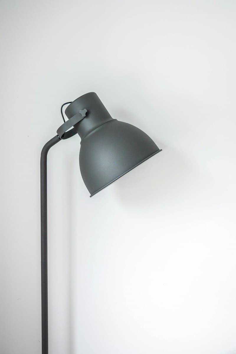 Minimalist portable rechargeable LED lantern with brass carry handle
